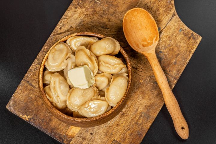Dumplings In A Wooden Bowl With Butter