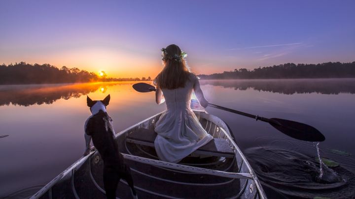 Girl In Boat With Dog