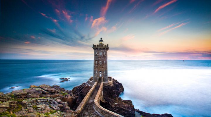 Big Lighthouse Against The Sky On A Cliff